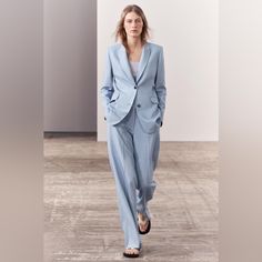 This Is A Set Of Jacket And Suit Pant. Brand New With Tag. Color: Light Blue. Jacket: Tailored Jacket Made Of Viscose Blend Fabric. Notched Lapel Collar And Long Sleeves With Buttoned Slits. Front Flap Pockets And Chest Welt Pocket. Tonal Interior Viscose Lining. Front Button Closure. A Clean Lined Jacket Full Of Details That Provide Structure, Like The Pointed Lapel And Subtle Shoulder Pads. The Softly Rounded Hem In Front Makes This Jacket With The Definitive Tailored Style Easy To Combine Wit Zara Suits With Notch Lapel For Work, Chic Tailored Spring Suits, Tailored Spring Pantsuit With Lapel Collar, Zara Tailored Suits For Fall, Spring Tailored Single-breasted Pantsuit, Zara Spring Workwear Pantsuit, Classic Spring Pantsuit, Classic Spring Pantsuit For Tailoring, Tailored Blue Pantsuit For Spring