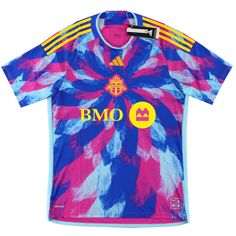 a blue and pink soccer jersey with the word bmo in yellow, white, and red