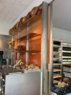 an industrial bakery with bread and pastries on shelves