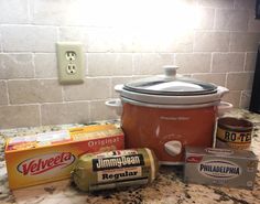 an electric crock pot and other ingredients on a kitchen counter