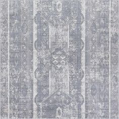 a gray and white rug with an intricate design