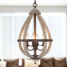 a chandelier hanging from the ceiling in a living room