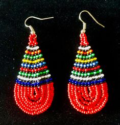 Ethnic Zulu Beadwork.  Tear drop snapped available in a variety of different colour combinations  Weight:  7g Length:  6.5cm Width:   2.5cm Multicolor Fair Trade Beaded Earrings, Traditional Teardrop Beaded Earrings With Large Beads, Traditional Multicolor Fair Trade Beads, Traditional Large Bead Drop Earrings, Festival Teardrop Beaded Earrings With Large Beads, Teardrop Beaded Earrings With Large Beads For Festivals, Traditional Large Beaded Drop Earrings, Traditional Colorful Dangle Beads, Teardrop Large Beaded Earrings For Festivals