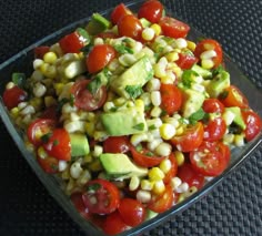 an image of a salad with tomatoes and avocado on the bottom right side