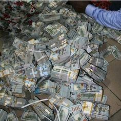 a pile of money sitting on the ground