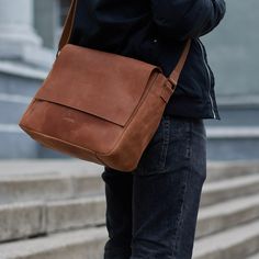 Leather Laptop Briefcase or Messenger Bag is a Perfect Gift Idea for Father/Dad/Grandfather/Father-in-law Made of genuine leather Crazy Horse, this messenger bag is an ideal option for trips, office, and school.  It is convenient to carry a laptop, wallet, documents, books, keys, everything you need to have at hand. This is a great gift, especially if you add personalization, for a friend, boyfriend, husband, brother, dad for any occasion. It has a flap-over design, and it is secured with a zipper. It's completed with a zippered pocket on the back and has an adjustable shoulder rep strap that means it suits any height perfectly. There is a large pocket inside, that will serve as a compartment for your laptop or tablet. Dimensions: Width: 34 cm / 13.4 in Height: 25 cm / 9.8 in Depth: 9 cm / Cognac Bag, Kelly Moore, Laptop Briefcase, Leather Laptop Bag, Briefcase For Men, Bags Aesthetic, Leather Laptop, Designer Crossbody Bags, Black Shoulder Bag