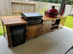 an outdoor bbq and grill on a patio