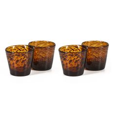 four glasses with animal print on them