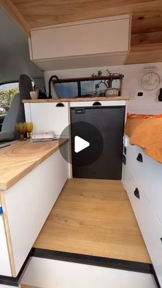 a kitchen area with a sink, dishwasher and stove top oven in it