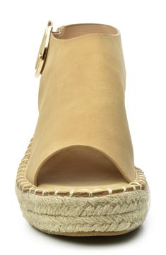 A woven espadrille wedge heel brings summery vibes to this chic sandal, finished with a peep toe and buckle strap closure. Sizing: True to size. 2.5" heel, 2" platform Espadrille wedge heel PU upper, manmade sole Imported This item cannot be shipped to Canada. Summer Wedge Sandals With Buckle, Beige Buckle Closure Wedge Sandals For Summer, Ankle Strap Espadrilles With Buckle Closure, Summer Wedge Sandals With Buckle Closure And Open Heel, Summer Wedge Sandals With Buckle Closure And Block Heel, Summer Block Heel Wedge Sandals With Buckle Closure, Vacation Espadrille Wedge Sandals With Open Heel, Spring Vacation Espadrille Slingback Sandals, Beach Wedge Sandals With Buckle Closure