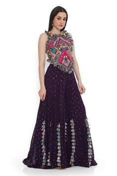 Purple and multi color sleeveless back tie-up choli with all over boho tribe vibe embroidery and tassel embellishments. Paired with a mukaish dot embroidered sharara with tassel detailing. - Aza Fashions Multicolor Fitted Sleeveless Sharara, Embellished Sleeveless Sets For Festivals, Embellished Sleeveless Festival Sets, Multicolor Sleeveless Sets With Mirror Work, Bohemian Style Sleeveless Set With Unstitched Blouse, Designer Sleeveless Bohemian Choli, Sleeveless Bohemian Choli, Sleeveless Dresses For Reception And Festivals, Bohemian Sleeveless Embellished Sets