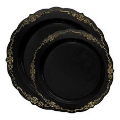 three black plates with gold designs on them