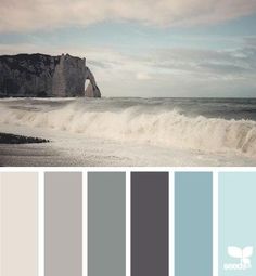 the color scheme is blue and grey, with white waves in the ocean behind it