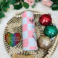 a pink and white tube next to ornaments on a wicker plate