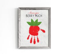 a red handprinted strawberry with the words i love you berry much on it