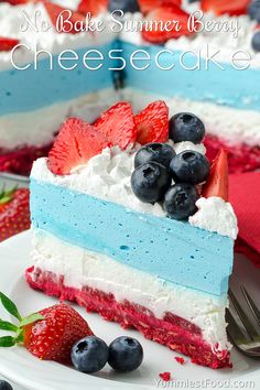 a piece of cake with blueberries and strawberries on top