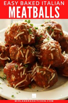 meatballs on a plate with parmesan cheese and parsley in the middle