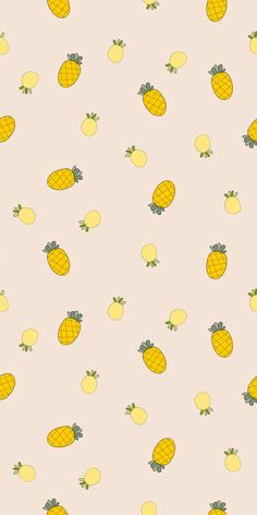 a bunch of yellow pineapples on a pink background