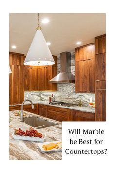 a kitchen with marble counter tops and wooden cabinets is featured in the article will marble be best for countertops?