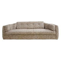 a beige couch sitting on top of a white floor