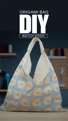 an origami bag is shown with the words diy in white and yellow