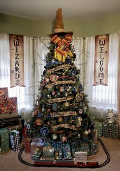 a christmas tree decorated with ornaments and ribbons