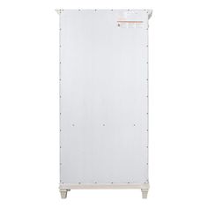 a tall white cabinet with metal studs on the front and bottom part, against a white background