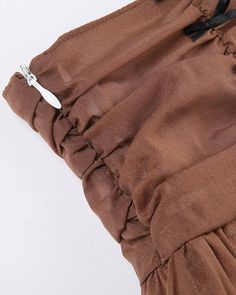 Details: Short skirt with strings designSkirt Length: ShortMaterials:95% Polyester + 5% Spandex Brown Party Bottoms With Flowy Fit, Flowy Long Skirt With Drawstring, Chic Tiered Skirt With Drawstring, Stretch Mini Skirt With Drawstring, Chic Skirt With Drawstring, Brown Ruffled Long Skirt, Chic Mini Skirt With Drawstring, Party Drawstring Mini Skirt, Chic Stretch Mini Skirt With Drawstring