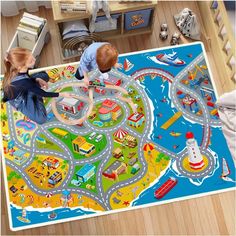 two children playing on a play mat in a room