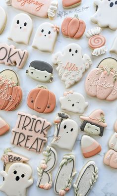 many decorated cookies are laying on a table