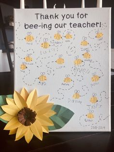 a card with bees on it and a sunflower in front of it that says, thank you for bee - ing our teacher