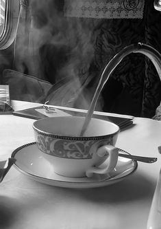 steam rising from a teacup on a table