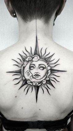 a woman with a sun tattoo on her back