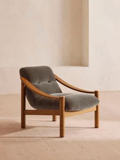 a wooden chair sitting on top of a hard wood floor