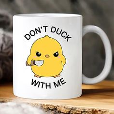 a coffee mug that says don't duck with me