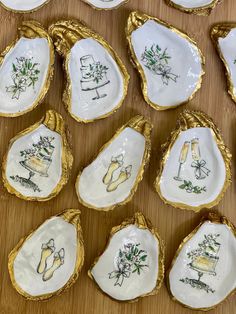 some white and gold decorated oysters on a table