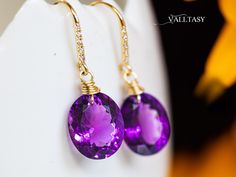 The Twilight Earrings - Solid Gold 14K Diamond Oval Amethyst Earrings, Genuine Natural Amethyst Earrings Stunning Amethyst Earrings that have a super vibrant, electric purple color. These earrings are composed of the most amazing genuine, natural high quality Amethysts.  These red-carpet worthy gemstones are absolutely clean and have an intense purple color. They hang from Solid Gold 14k gold unique earwires that are set with 5 diamonds each. ⭐ DETAILS: ✔️ Length including earwires: 1.25″ (about Purple Oval Fine Jewelry Earrings, Oval Amethyst Earrings With Gemstone Accents, Purple Oval Earrings With Gemstone Accents, Purple Oval Earrings For Weddings, Twilight Earrings, Electric Purple, Oval Earrings, Solid Gold Earrings, Earrings Diamond