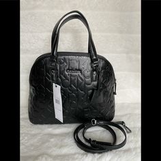 Brand New Beautiful Black Satchel Ck Logo Calvin Klein Vegan Embossed Handbag Shoulder Tote Purse A Very Special Bag With A Unique Look. Sure To Stand Out Among The Others. Great Size For Everyday Use. * Main Body Zipper * 1 Interior Zipper, * Multiple Slip Pockets * Removable Adjustable Shoulder Straps * 2 Leather Hand Straps With 6”Drop * Black Tone Hardware H 9.5” W 12” D. 5” Black Handheld Satchel With Branded Hardware, Calvin Klein Leather Bag With Top Carry Handle, Calvin Klein Black Rectangular Bag, Black Rectangular Calvin Klein Bag, Black Leather Calvin Klein Bag, Modern Calvin Klein Black Bag, Modern Black Calvin Klein Bag, Calvin Klein Black Crossbody Bag, Calvin Klein Black Shoulder Bag For Daily Use