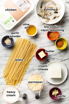 the ingredients to make pasta laid out on a marble counter top with text overlay