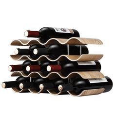 a stack of wine bottles sitting next to each other on top of a wooden rack