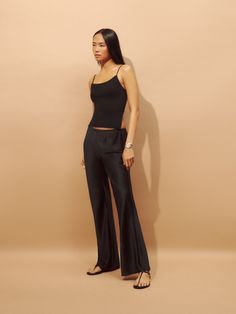 No nonsense. Shop the Gale Satin Mid Rise Bias Pant from Reformation, a mid rise, bias cut pant with an elastic waistband. Satin Pants Outfit, Satin Pants, Swimming Outfit, Swimwear Dress, Vintage Inspired Dresses, Midi Length Skirts, Fancy Pants, Silk Pants, Business Attire