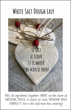 a white heart with red berries on it and the words, white salt dough easy