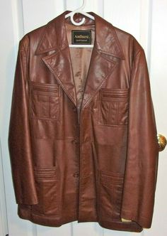 1970s Vintage Brown Leather Mens Coat Size 44 Andhurst brand, Dryclean only on tag. This coat is very good for vintage. The color is medium brown.  4 double pockets on the front and one pocket on inside. Sleeve length is 27", center back neck to bottom measures 33", armpit to armpit is 22", across back of shoulders at yoke from to arm to arm is 16". Below the waist panel in the back, the design has a split.  Pretty good gently used condition with no damage or spots or anything that I can detect. Vintage Brown Leather Jacket For Formal Occasions, Vintage Outerwear With Leather Lining For Work, Retro Leather Outerwear For Formal Occasions, Vintage Business Leather Jacket With Pockets, Vintage Leather Jacket With Pockets For Business, Vintage Formal Leather Jacket With Pockets, Vintage Leather Jacket With Pockets For Formal Wear, Vintage Leather Jacket With Pockets For Formal Occasions, Leather Man