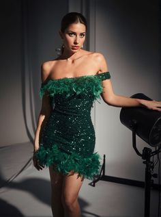 Amaris Off Shoulder Sequin Feather Mini Dress In Green Make a bold statement at your next event with the Amaris Off Shoulder Sequin Feather Mini Dress. This eye-catching dress features an allover sequin design that shimmers like green feathers, perfect for making you stand out in any crowd. Dress Details Material: 100% Polyester Closure Type: Back Zipper Stretch Factor: Non-Stretch Recommended Care: Dry Clean Only Note on Color Accuracy: The color in images may vary due to lighting. The product Emerald Green Mini Dress, Feather Mini Dress, Dresses Outfit Ideas, Green Feathers, Mini Dress With Ruffles, Spring Evening, Emerald Green Dress, Dress Cocktail Party, Date Outfit Ideas