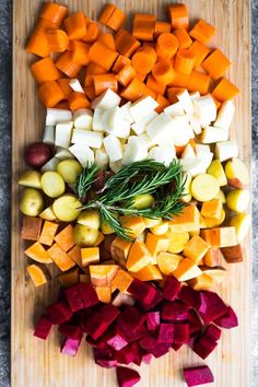 chopped up vegetables on a cutting board ready to be cooked