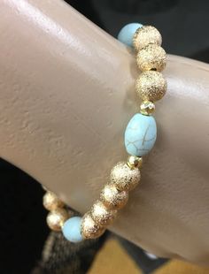 These mint turquoise stack design collection takes 5 separate bracelets to create the unique stack, create your own or wear them separately. Each bracelet is made of the finest crystal glass beads, hematite, semi-precious stones, and natural stones to create longevity and a beautiful sparkle. Gold Amazonite Beaded Bracelets, Elegant Turquoise Stretch Bracelet With Spacer Beads, Gold Amazonite Gemstone Beads Jewelry, Gold Amazonite Jewelry With Gemstone Beads, Turquoise Stackable Stretch Bracelet With Round Beads, Turquoise Stretch Bracelet With Round Beads, Turquoise Stretch Bracelet With Stackable Round Beads, Elegant Turquoise Stretch Bracelet With Natural Stones, Elegant Turquoise Crystal Bracelet With Spacer Beads