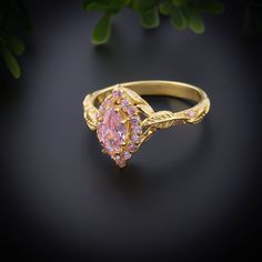 Introducing our stunning Marquise Cut Pink Topaz Ring, a perfect blend of modern elegance and vintage charm. This exquisite piece features a vibrant pink topaz, meticulously cut into a marquise shape, ranging from 4-8 mm to suit all preferences. Available in three luxurious finishes - Silver, Gold, and Bronze - this ring is designed to cater to diverse tastes and styles. Ideal for engagements, bridal bands, or a heartfelt promise ring, this unique piece is sure to capture attention and admiration. The 1.5Ct pink topaz radiates brilliance and beauty, enhanced by the marquise cut that maximizes its sparkle. Each ring is crafted with precision and care, ensuring a flawless finish that reflects our commitment to quality and craftsmanship. Whether you're seeking a timeless piece for a special o Pink Topaz Ring, Pink Topaz, Bridal Bands, Pink Ring, Vintage Engagement, Marquise Cut, Topaz Ring, Modern Elegance, Promise Ring