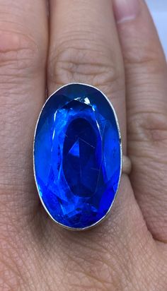 Large genuine blue volcanic art glass Vintage ring Low content silver not sterling. Size 8 Our jeweler can re size this for a $20 fee.  All rings are shipped in a nice gift box.   Check out our over a THOUSAND great reviews Engraving is $4 per letter and is not always perfect depending on the piece. It can take a few days if the jeweler is busy. This is payable to Paypal Judithsltd@gmail.com Blue Rings With Large Stone For Healing, Spiritual Blue Crystal Gemstone Ring, Spiritual Blue Crystal Ring, Spiritual Blue Crystal Ring Gift, Blue Spiritual Crystal Ring For Gift, Spiritual Blue Crystal Ring For Gift, Spiritual Blue Sterling Silver Crystal Ring, Spiritual Blue Crystal Ring In Sterling Silver, Unique Blue Nickel-free Rings