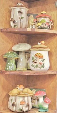 the shelves are filled with different types of pottery