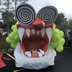 an inflatable monster with big eyes and large teeth on it's head